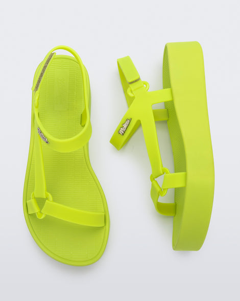 Top and side view of a pair of green Sun Downtown Platform sandals