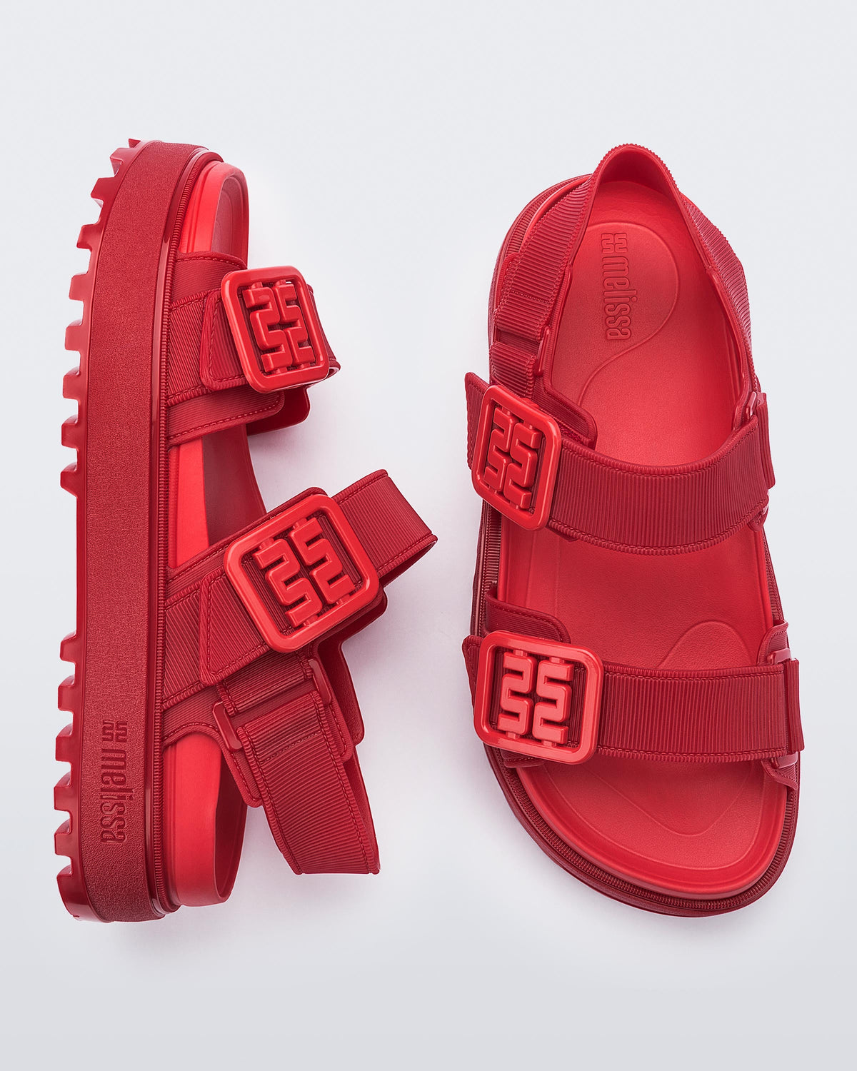 Side and top view of a pair of red Towny sandals with straps