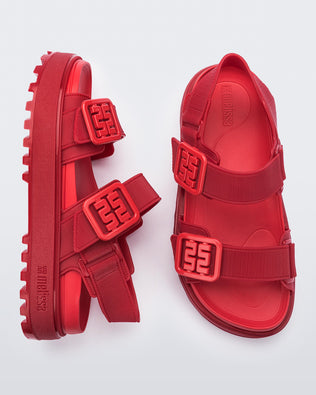 Side and top view of a pair of red Towny sandals with straps