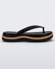Side view of a black/beige Melissa Leblon platform flip flop with details that mimic sisal braids on the sole and strap
