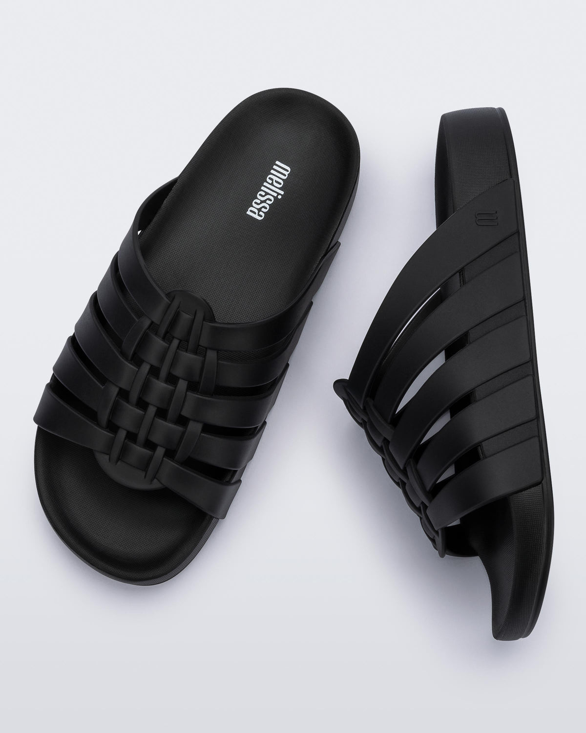 Top and side view of a pair of black Possession Slide