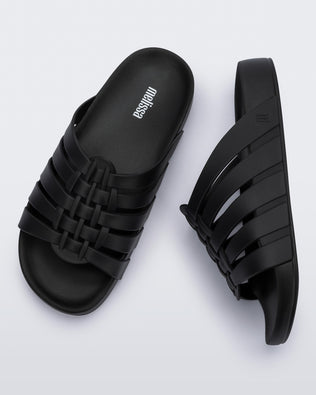 Top and side view of a pair of black Possession Slide