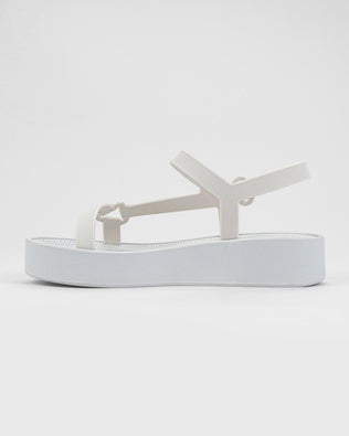 Inner side view of a pair of white Sun Downtown Platform sandals