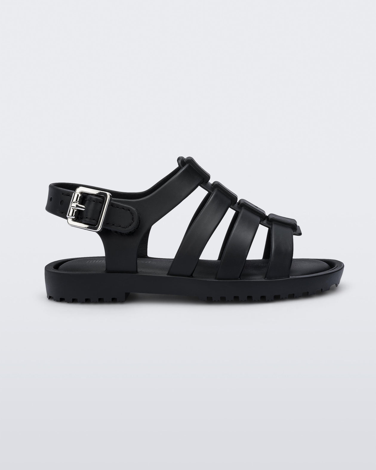 Side view of a black Mini Melissa Flox sandal with straps with straps.