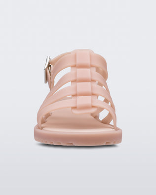 A front view of a pink Melissa Flox sandal with straps.