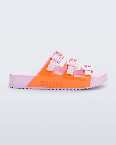 Side view of a pink and orange Cozy Stripe slide