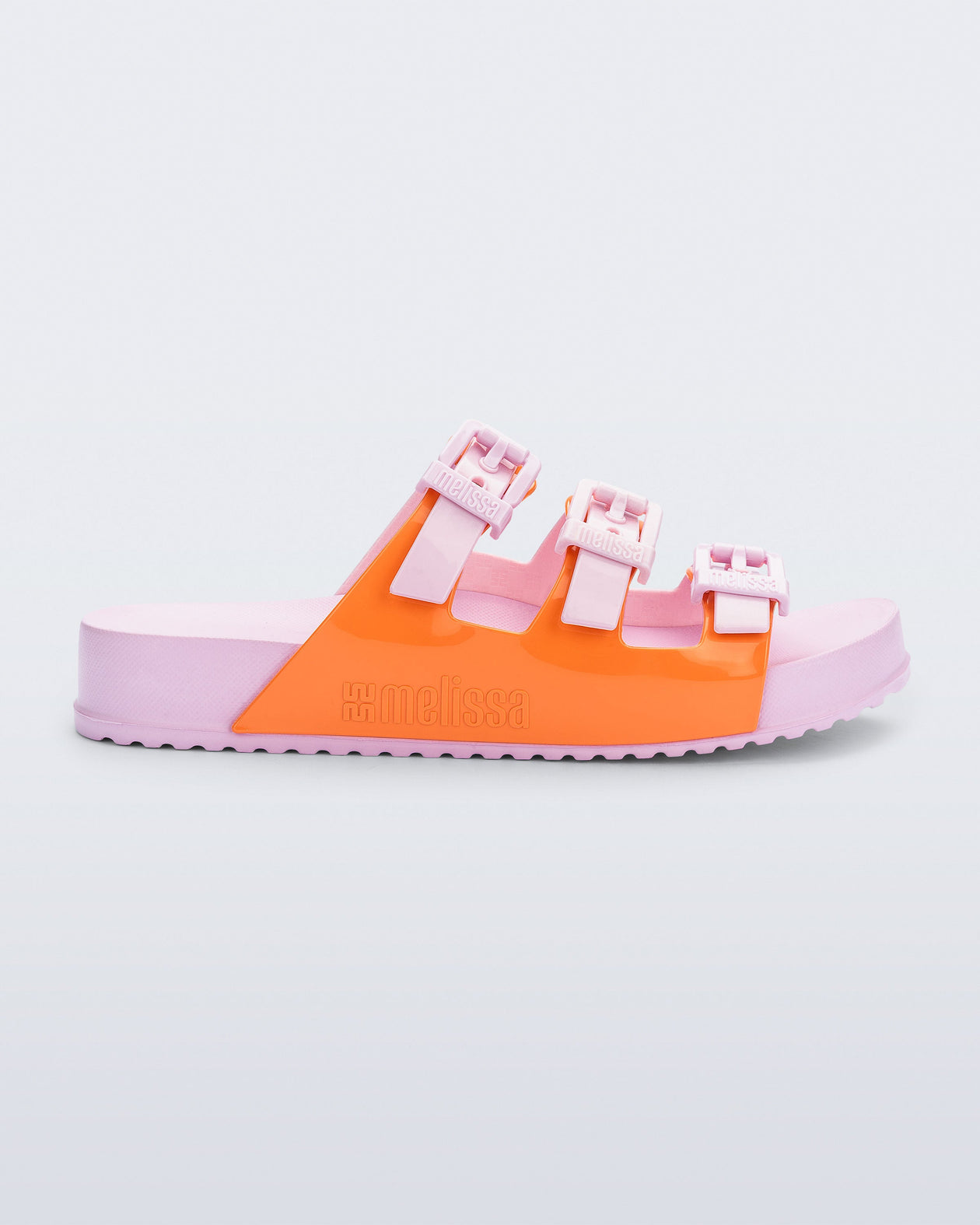 Side view of a pink and orange Cozy Stripe slide