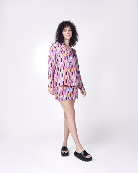 Model in multi colored outfit wearing a pair of black Free Platform women's Slides