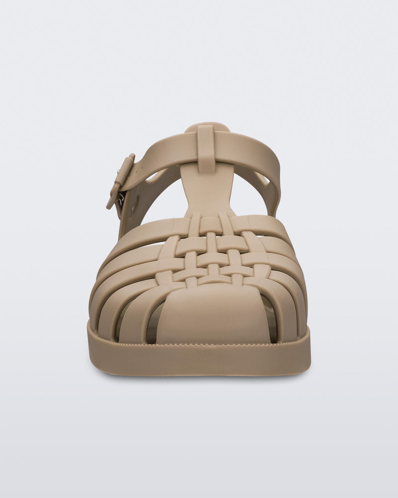 A front view of a pair of Dark Beige Melissa Possession sandals with several straps and a closed toe front.
