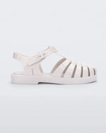 Side view of a white Mini Melissa Possession sandal with several straps and a white base.