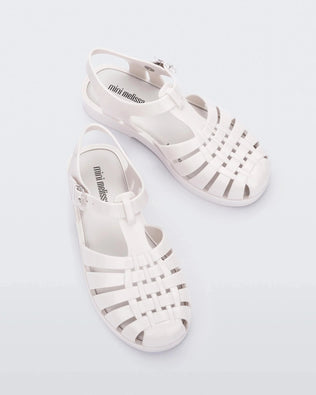 Top view of a pair of white Mini Melissa Possession sandals with several straps and a white base.
