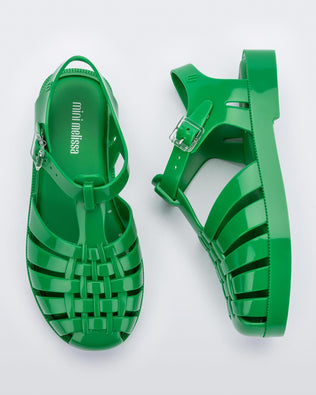 A top and side view of a pair of green Mini Melissa Possession sandals with several straps and a green base.