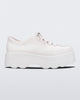 Side view of Melissa Kick Off platform sneaker in white. The sneaker has traditional white tie up laces.