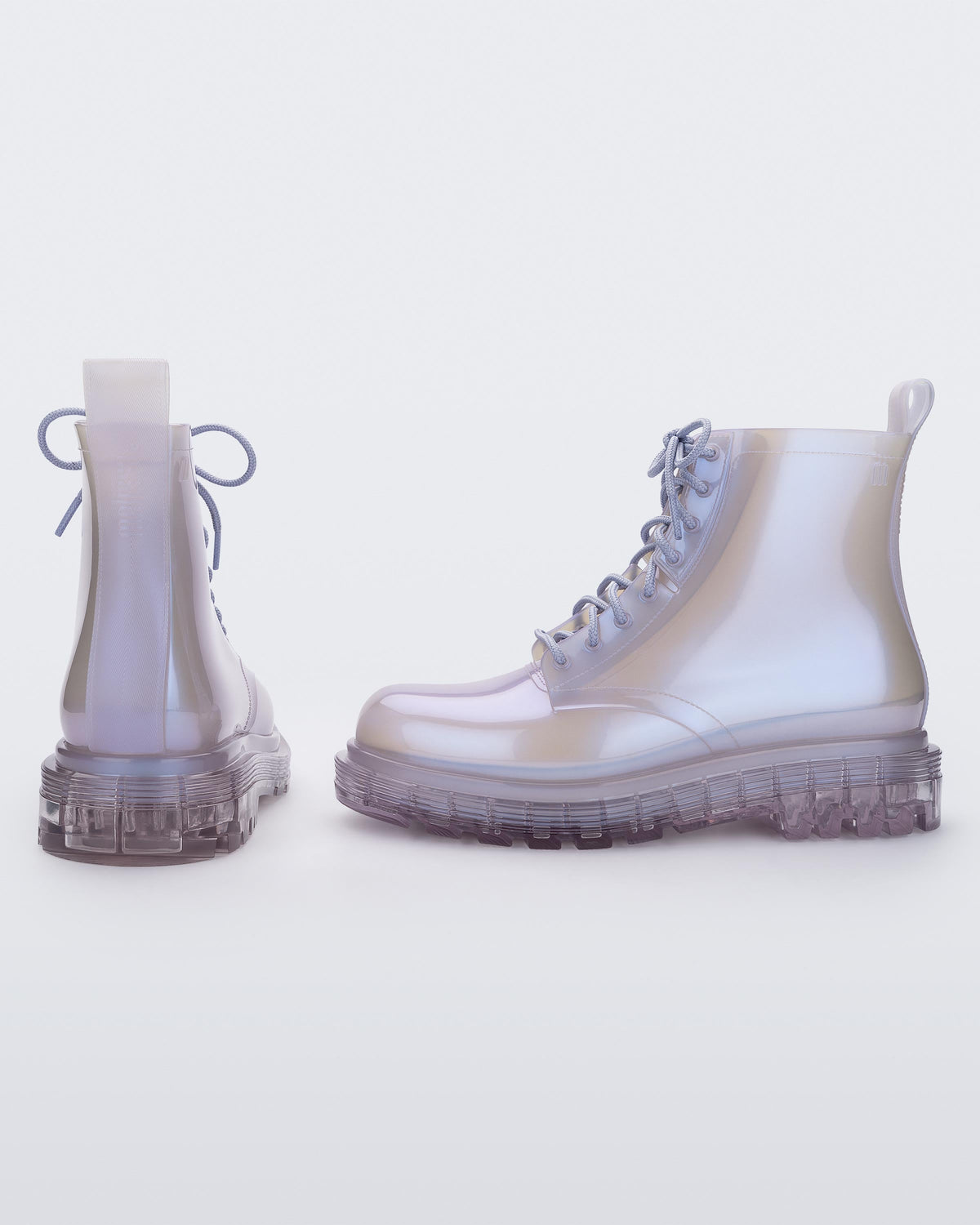 Side and back view of a pair of a pearly lilac Melissa Coturno boots.