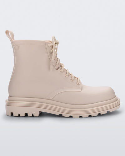 Side view of a beige Melissa Coturno boot.