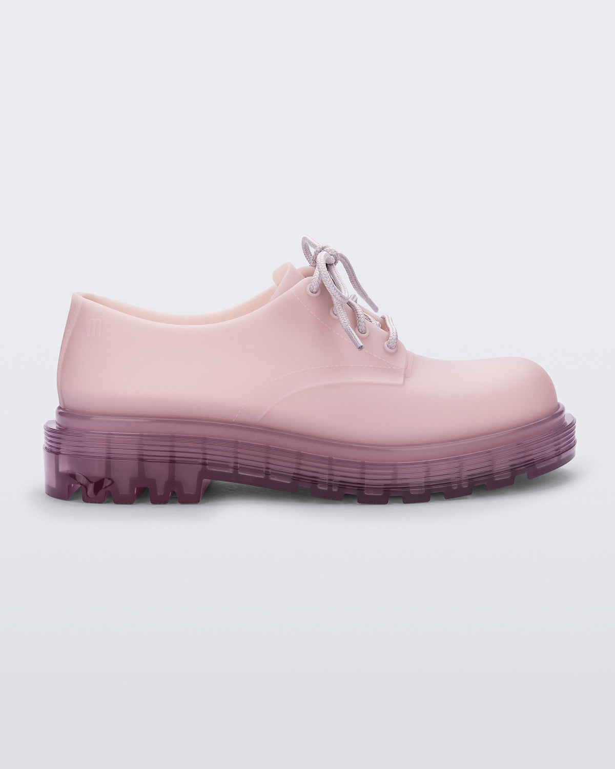Side view of a matte lilac Melissa Bass sneaker, with a light matte lilac base, lilac laces and a darker transparent lilac sole.