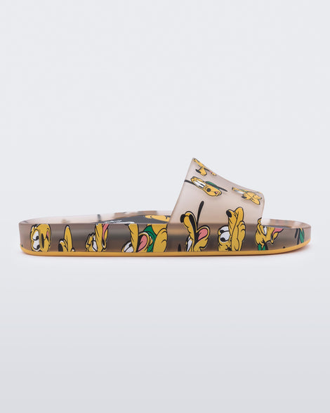 Side view of a clear beige / yellow Mini Melissa Beach slide with a beige base and a pattern of Disney's Pluto the dog with different facial expressions.