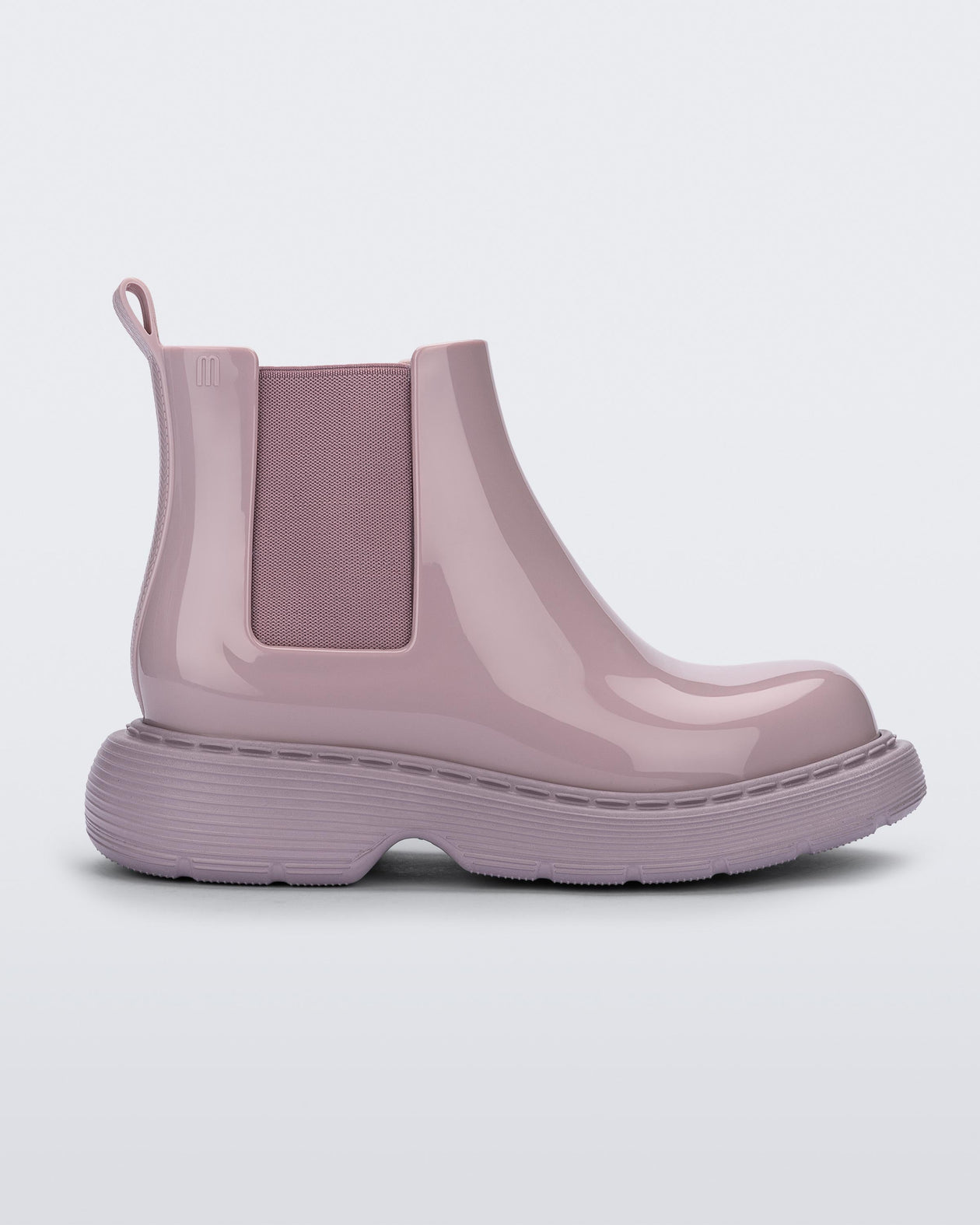 side view of a Melissa Step slip on ankle boot in Lilac with lug sole. 