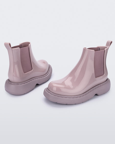Angled view of a pair of Melissa Step slip on ankle boots in Lilac with lug sole. 