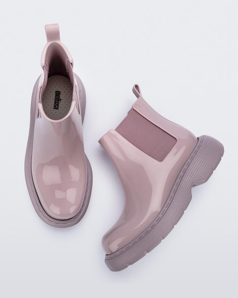 Top and side view of a pair of Melissa Step slip on ankle boots in Lilac with lug sole. 
