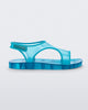 Side view of a translucent blue Mini Melissa Aqua sandal with two straps cojoining in the middle and a velcro back strap.