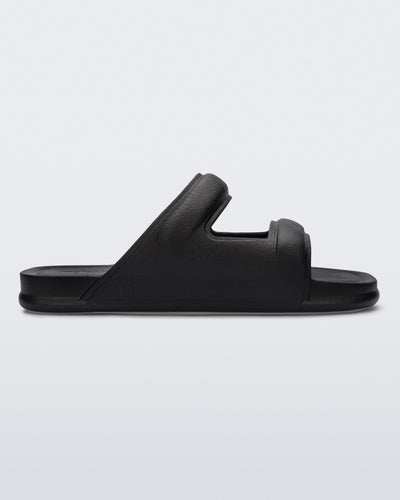 Side view of a black Melissa Free Grow slide with a square cut out on the front.