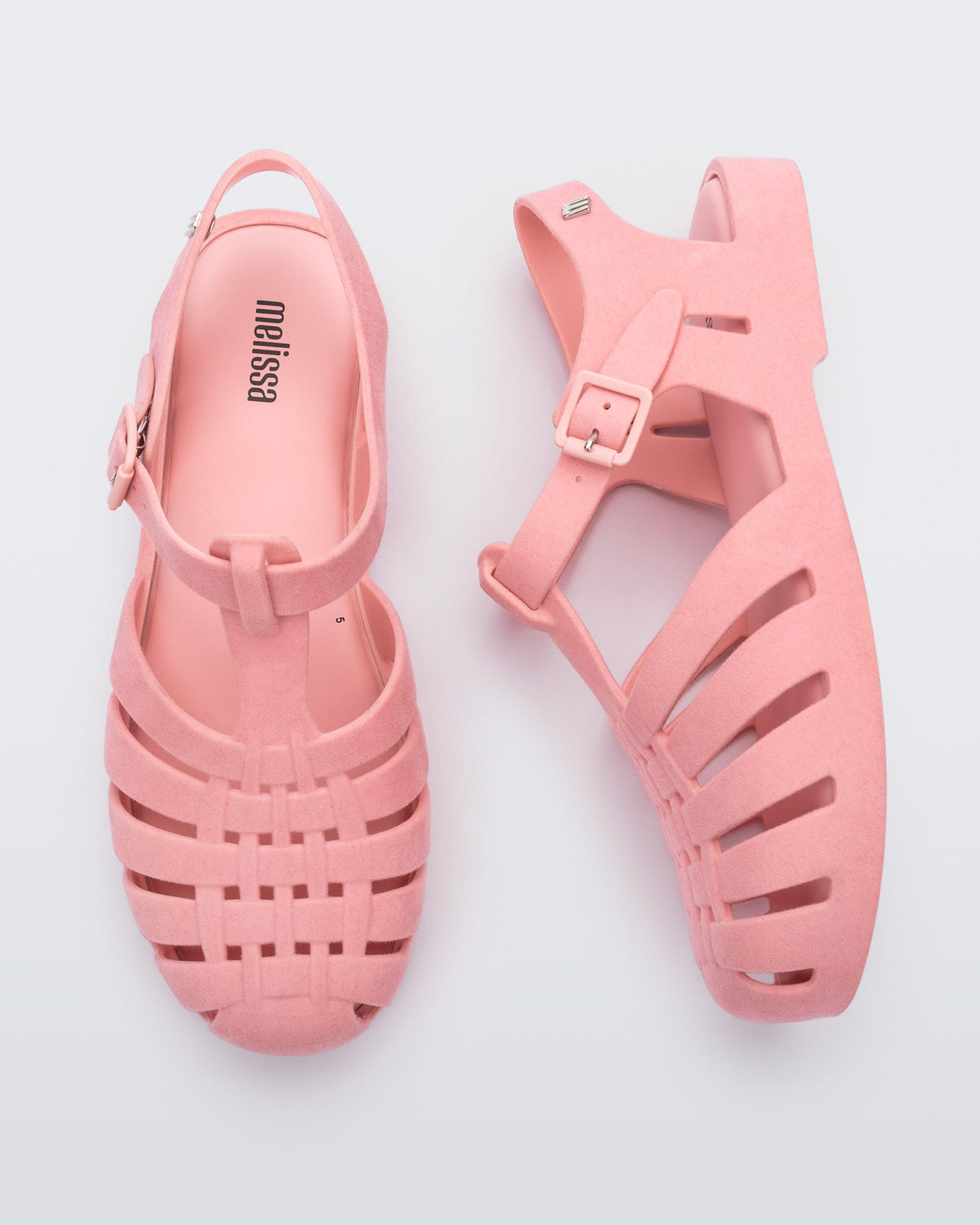 Top and side view of a pair pink flocked Melissa Possession Velvet sandals.