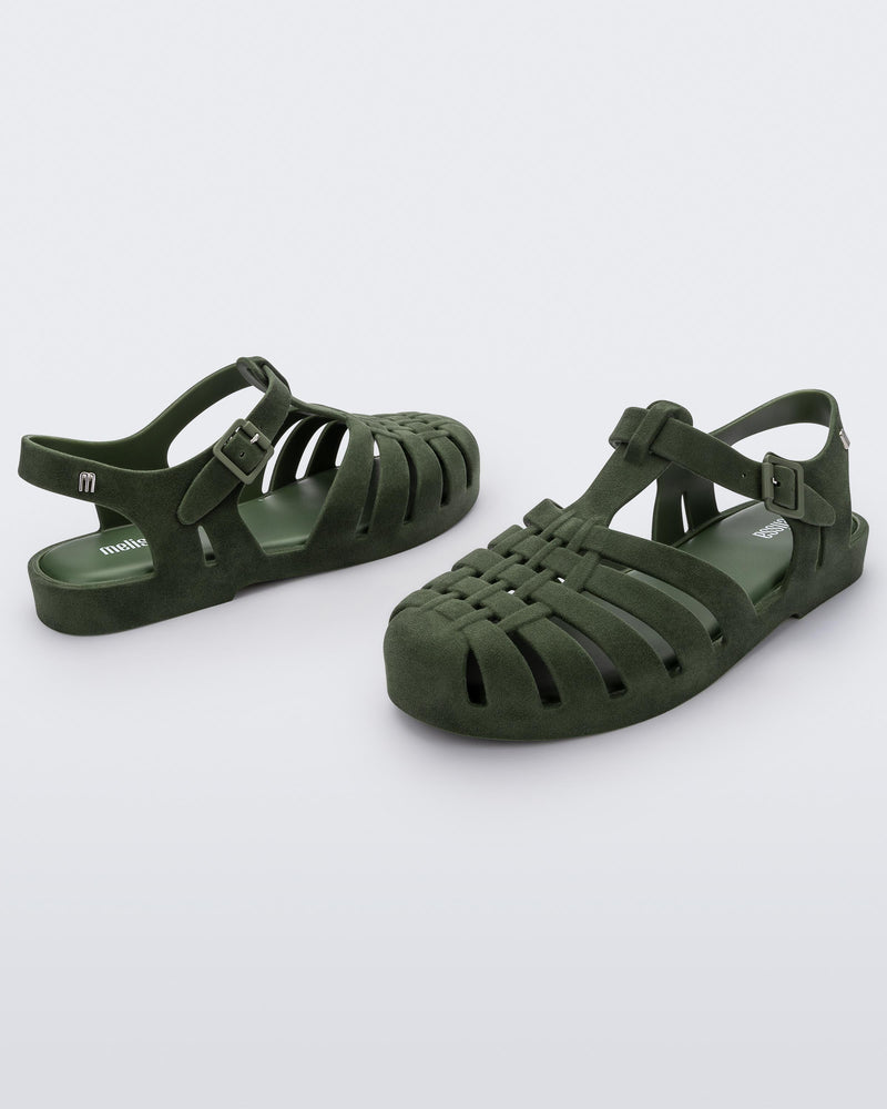 Angled view of a pair green flocked Melissa Possession Velvet sandals.