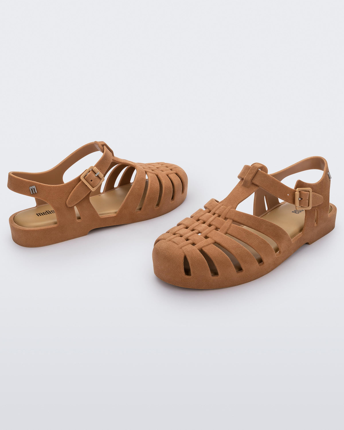 Angled view of a pair beige flocked Melissa Possession Velvet sandals.