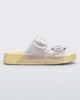 Side view of pearly yellow Cozy slide with two buckle straps.