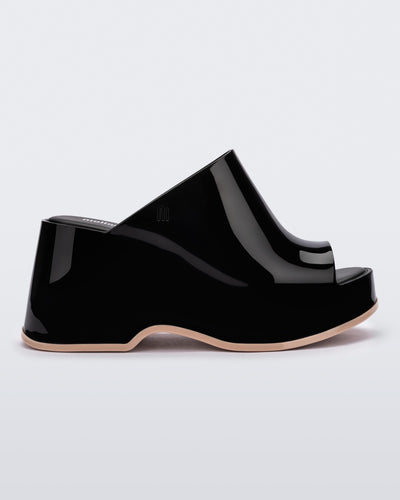 Side view of a Black Melissa Patty platform mule with beige outsole.