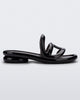 Side view of a Melissa Jelly Slides + Telfar in black.