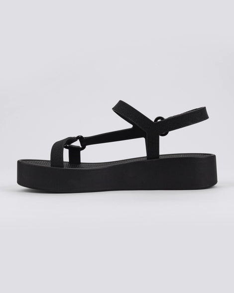 Inner side view of a pair of black Sun Downtown Platform sandals