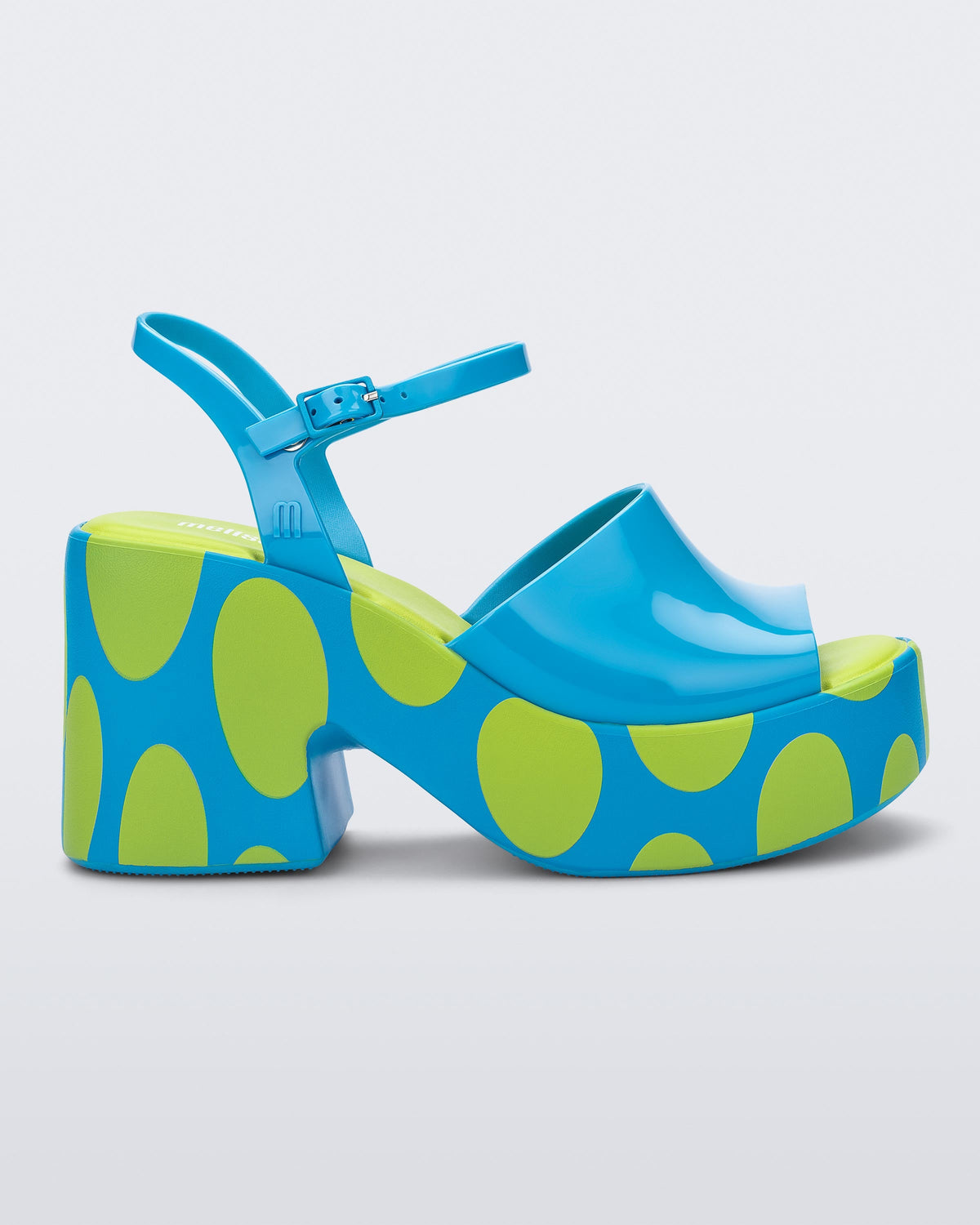 Side view of a blue with green polka dot sole Lina platform heel