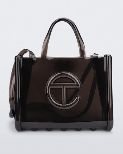 Front view of a black medium Melissa Jelly Shopper bag + Telfar bag with a handle and straps.