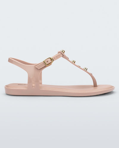 Side view of a pink Melissa Solar studs sandal with gold studded t-strap and gold buckle.