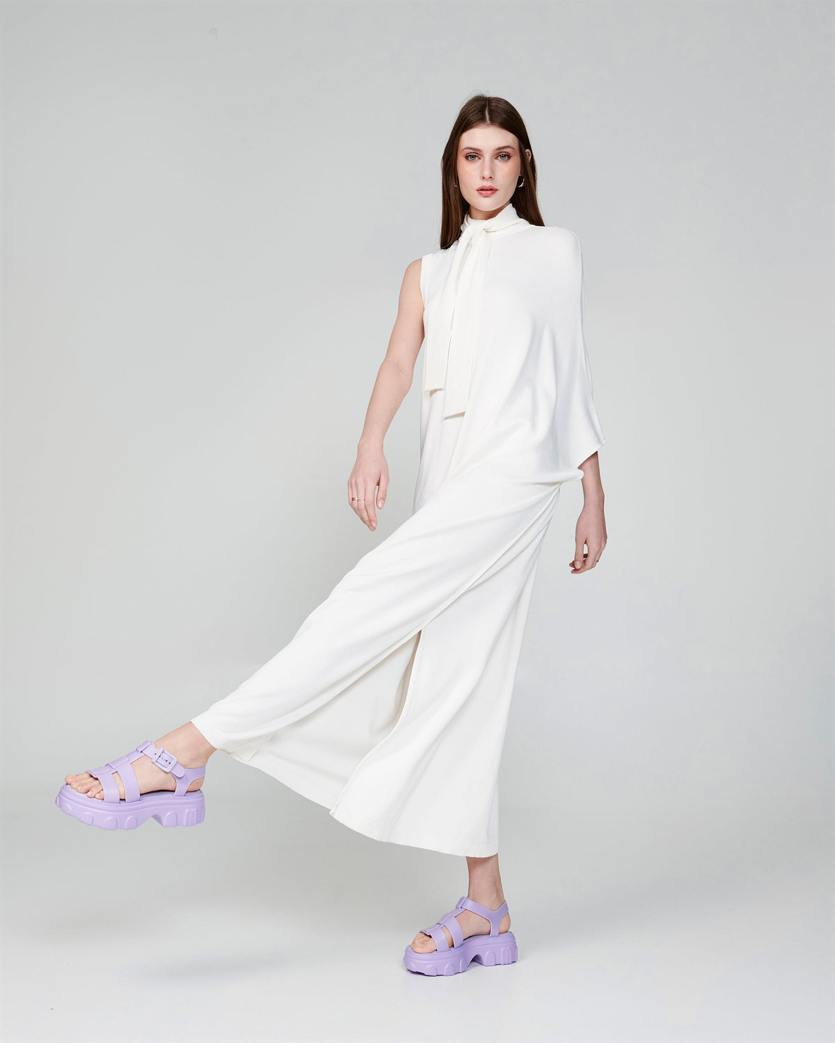 Model in a white outfit wearing a pair of lilac Ella platform sandals