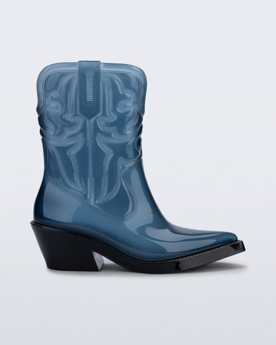 Side view of a transparent blue Texas boot with pointed toe.