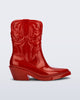 Side view of a red Texas boot with pointed toe