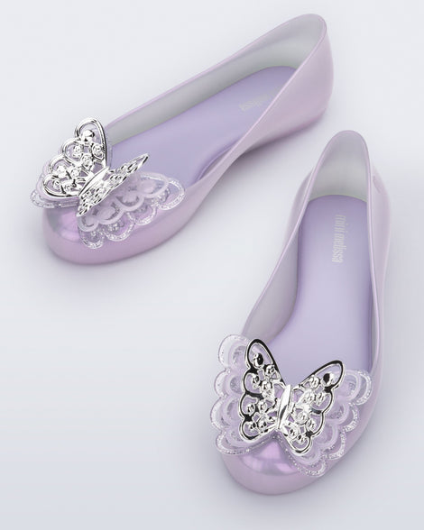 Top angled view of a pair of purple Sweet Love Butterfly kids flats.