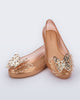 angled view of a pair of gold Sweet Love Butterfly kids flats.