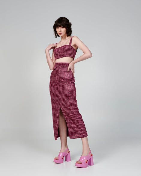 Model in a pink dress wearing a pair of pink Dance Heel platforms