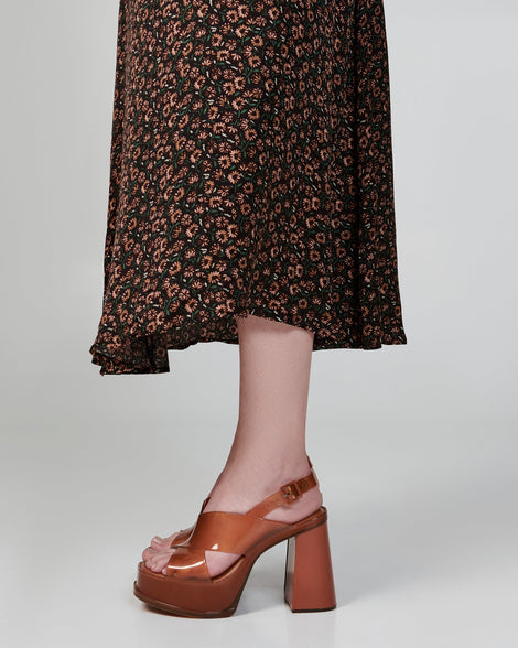 Model's legs wearing a pair of brown Dance Heel platforms