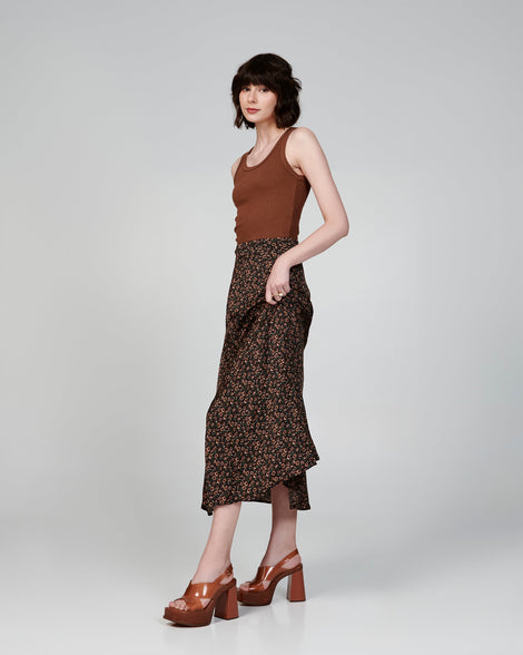 Model in a brown outfit wearing a pair of brown Dance Heel platforms