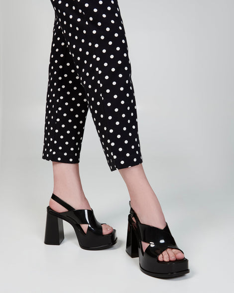 Model's legs in a pair of black Dance Heel platforms