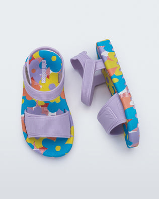 Side and top view of a pair of purple baby Imagine sandals.