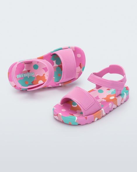 Top and angled view of a pair of pink baby Imagine sandals