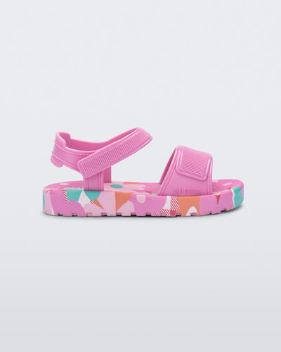 Side view of a pink baby Imagine sandal