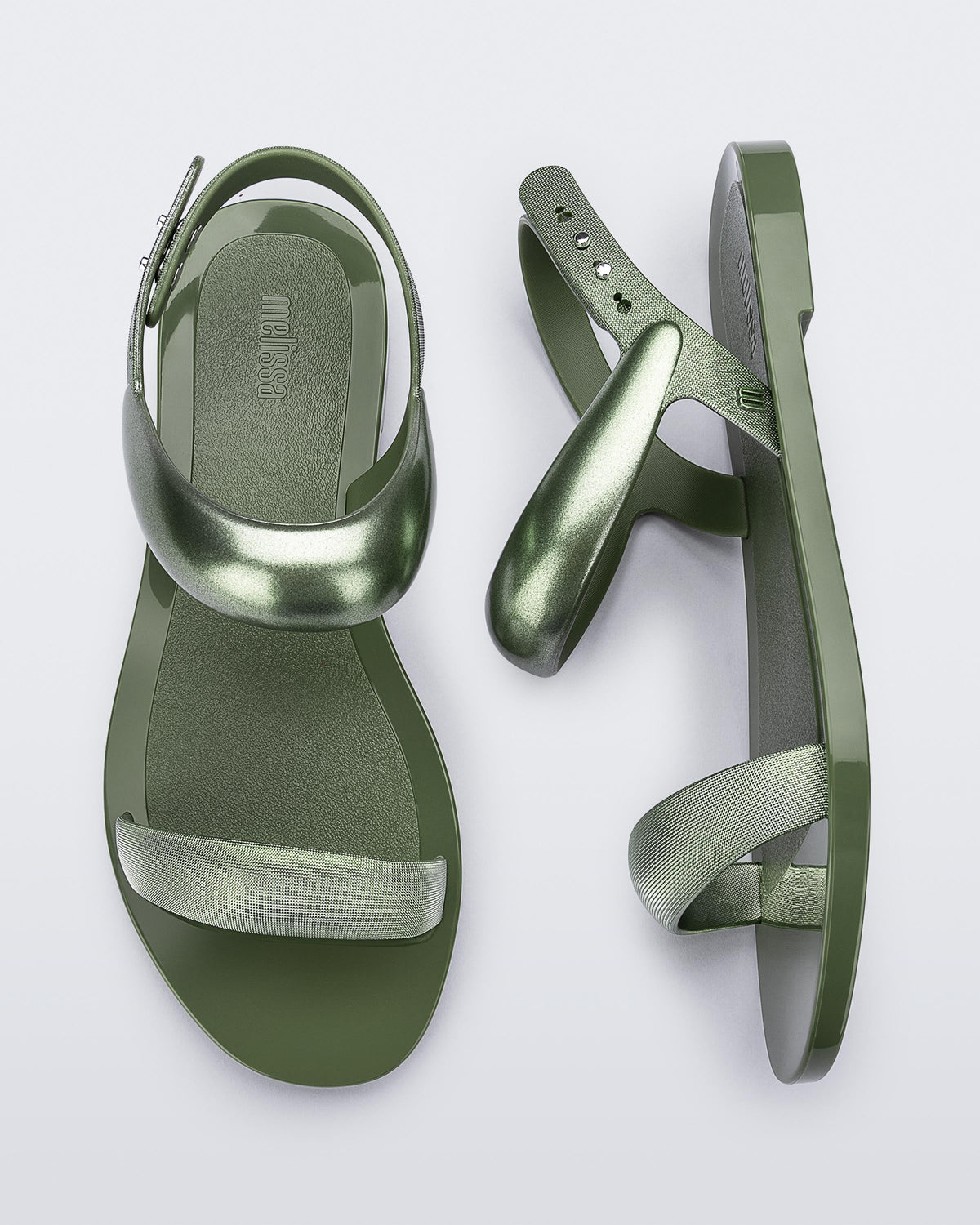 Top and side view of a pair of green Eclipse Sandals with glitter green straps.