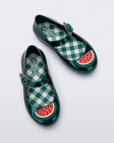 Top view of a pair of green Sweet Love Picnic baby flats with watermelon slices